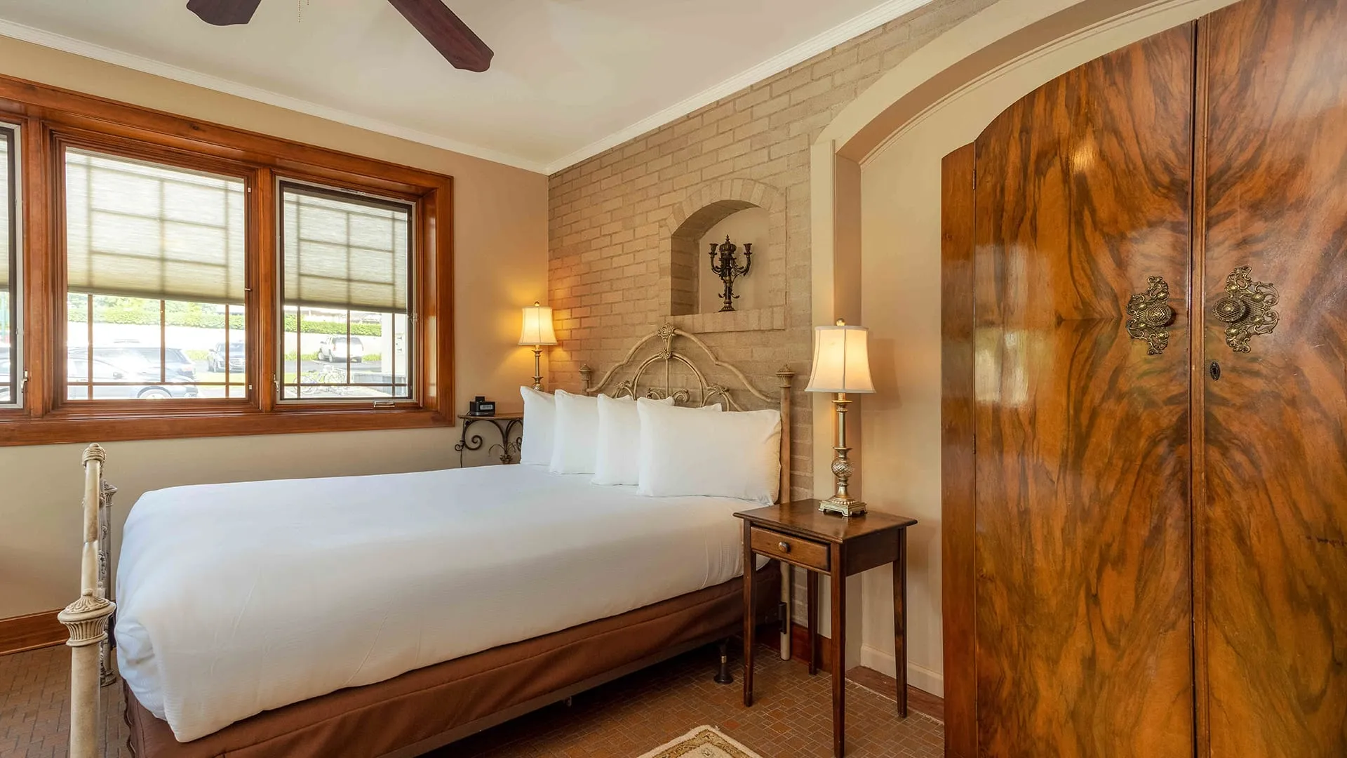 bedroom with view of closet bed and window.