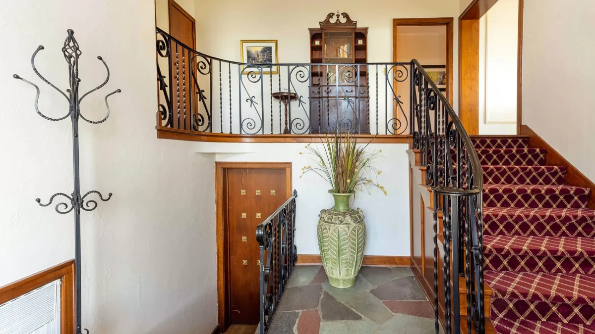 Red stairway with basement.