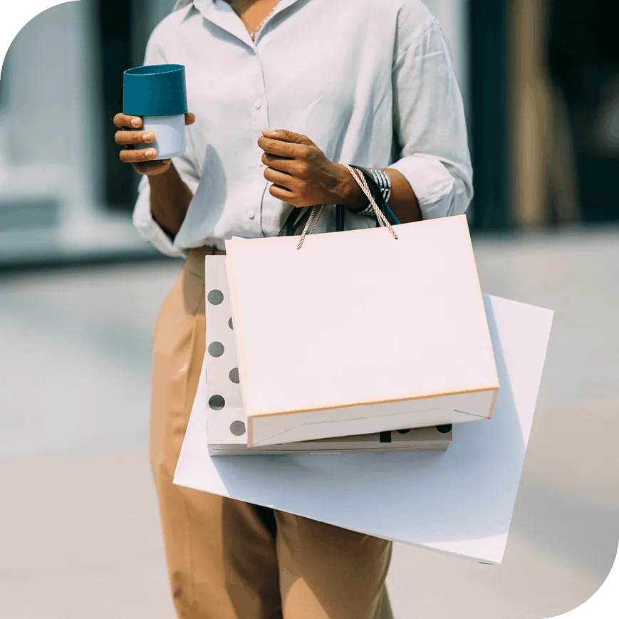 A woman shopping and holding bags.