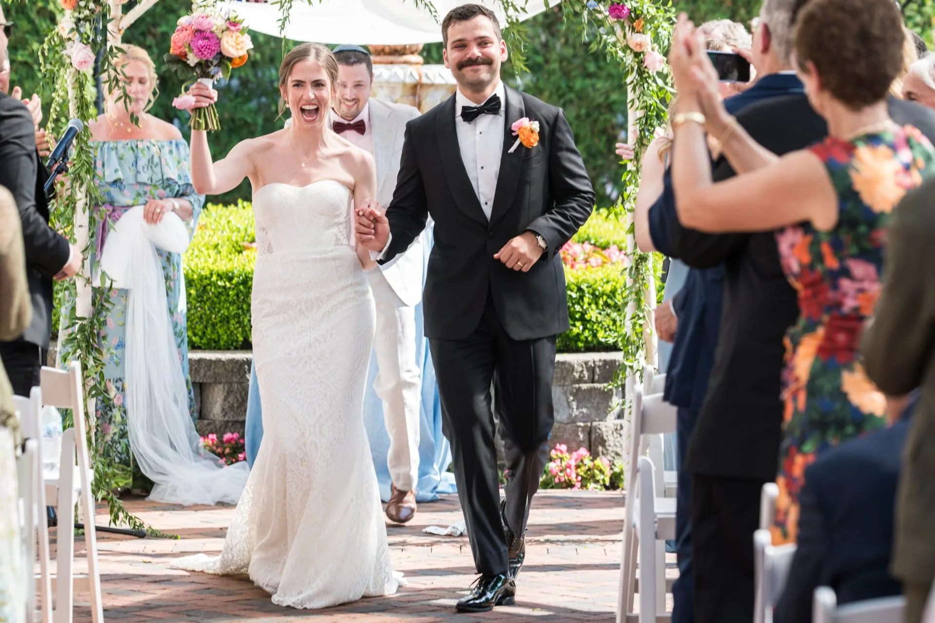 Bride and Groom after ceremony walking down isle.