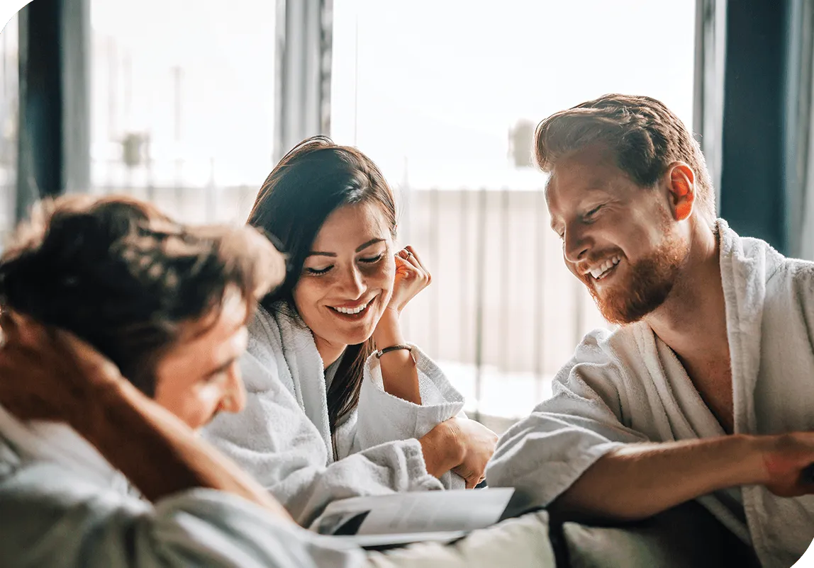 a group of people gathered in bathrobes.