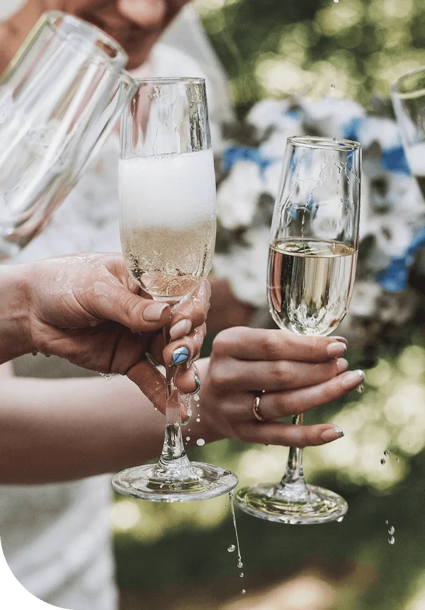 Women celebrating with champagne in cheers.