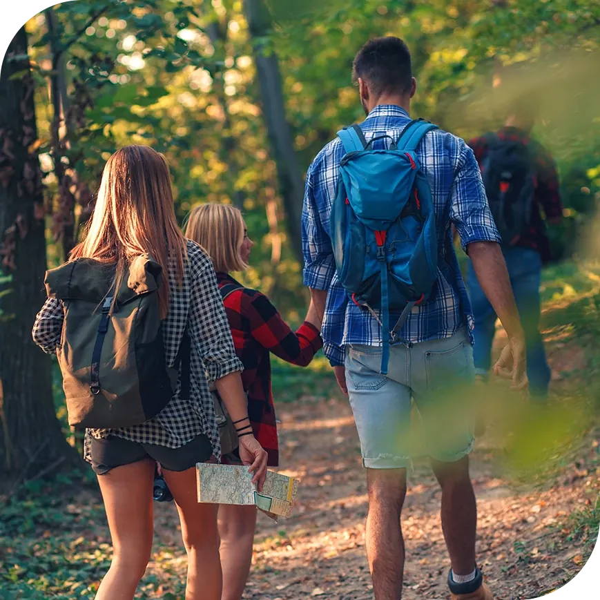 A family hiking through the forest.